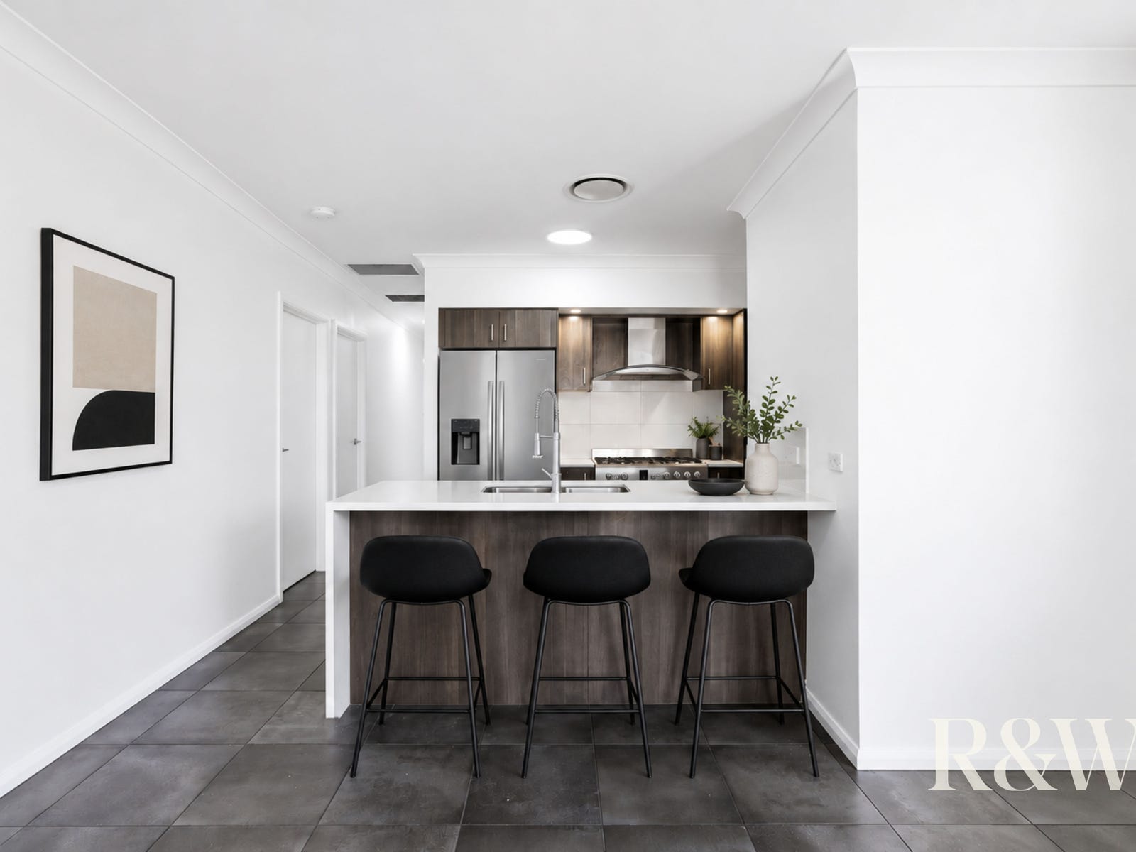 Kitchen with island bench at 9 Arkley Avenue